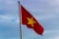 red and yellow flag with star on pole
