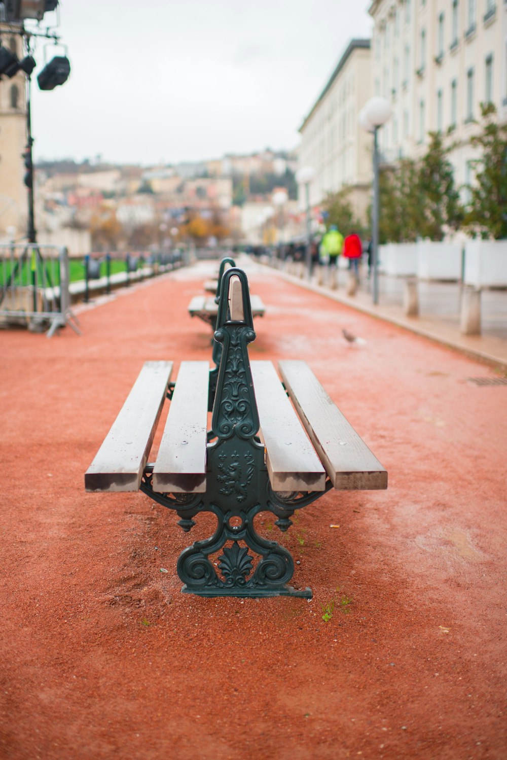 brown wooden bench with black metal base