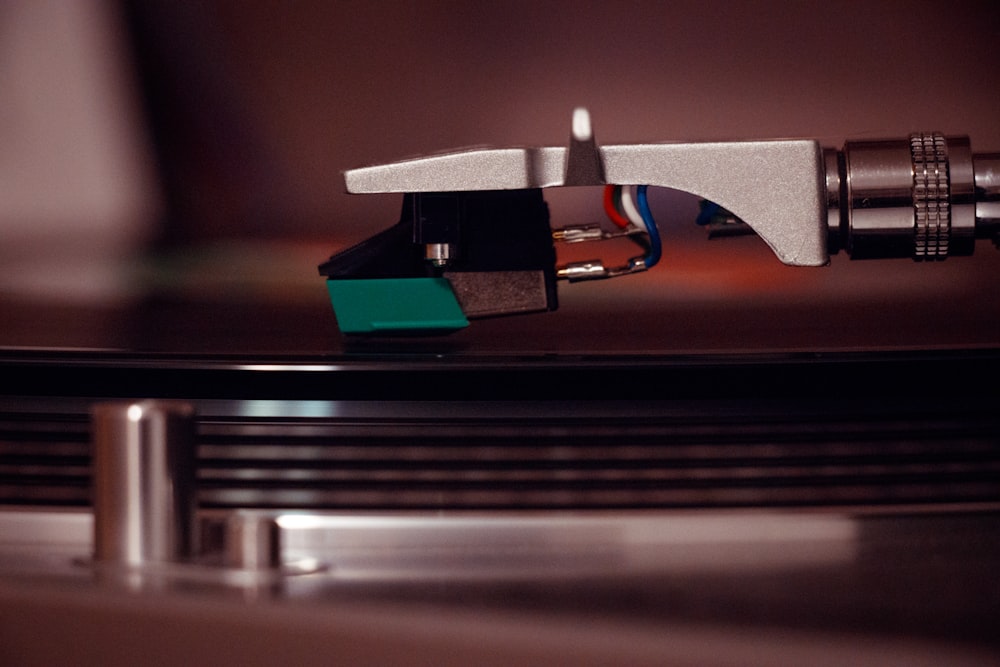 selective focus photography of vinyl player