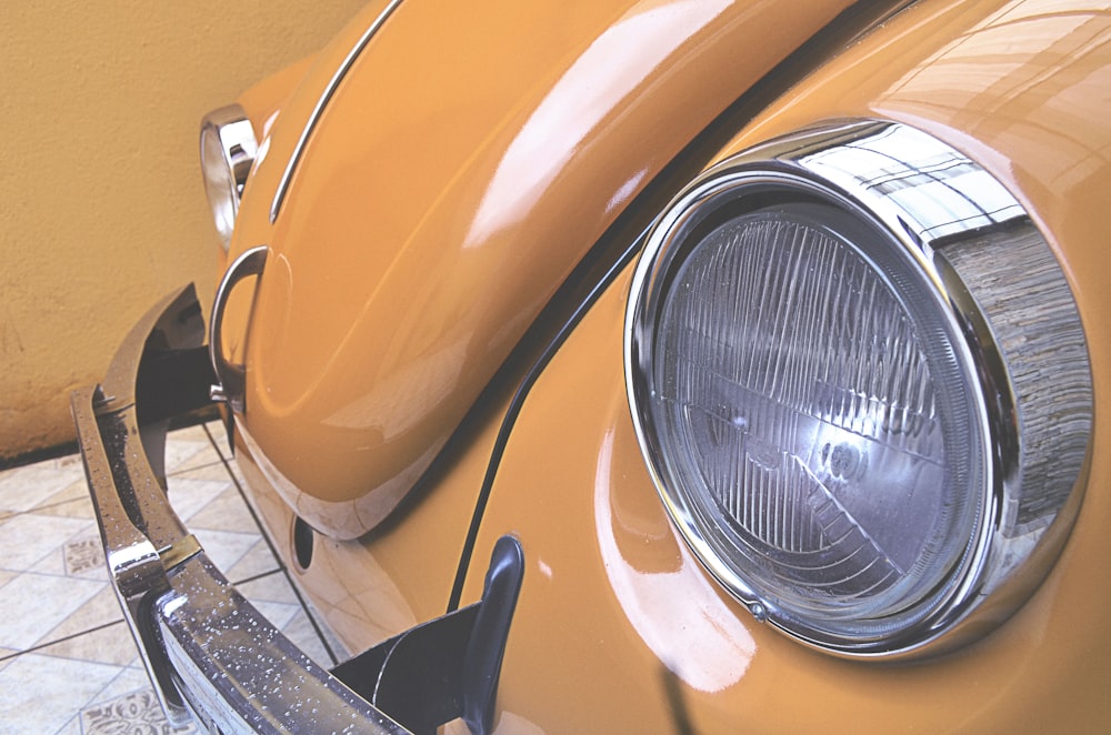 orange Volkswagen Beetle bumper and headlights