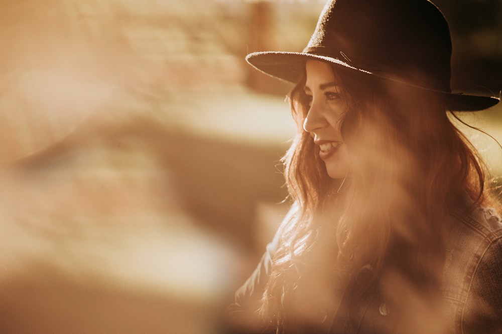 woman wearing black hat