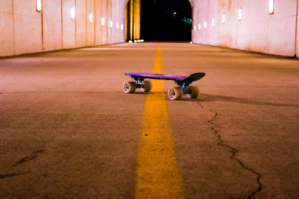 purple cruiser board on road