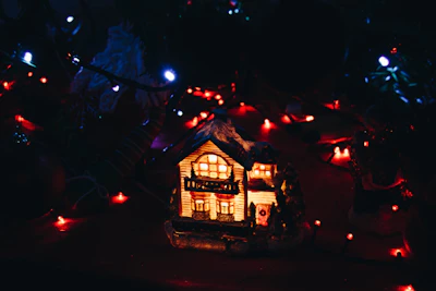 A cozy, secure home with a glowing light inside, representing home insurance.