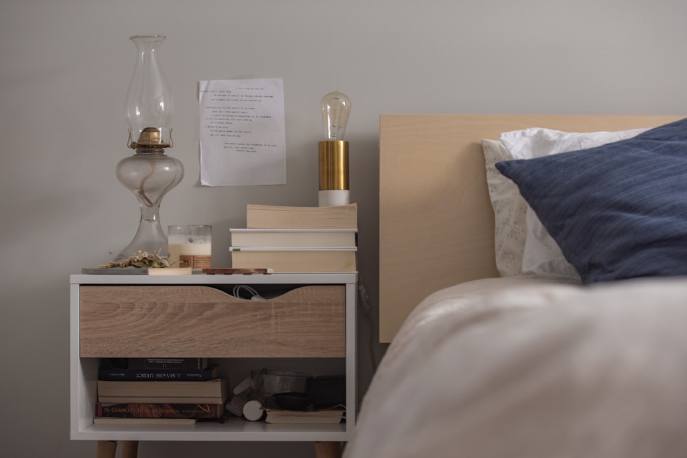 unlighted clear glass gas lamp on end table