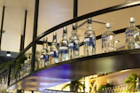 Elegant glass bottles arranged neatly in a luxury hotel lobby bar, reflecting the brand’s purity.