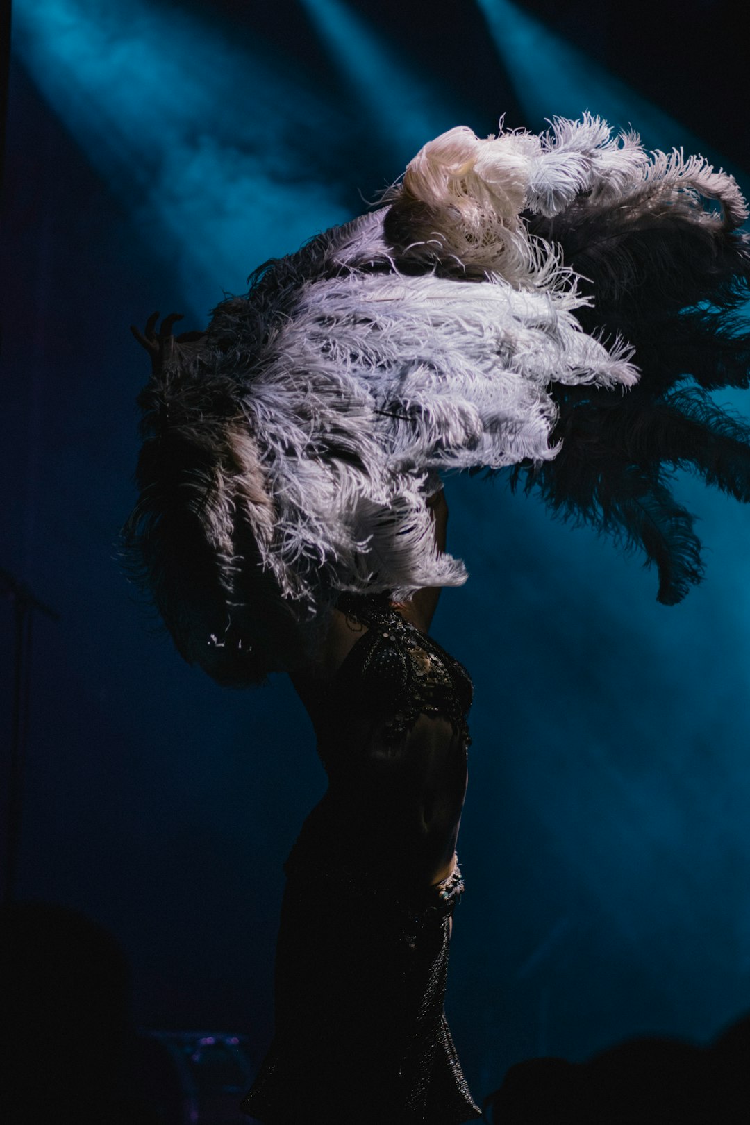 woman lifting fur textile