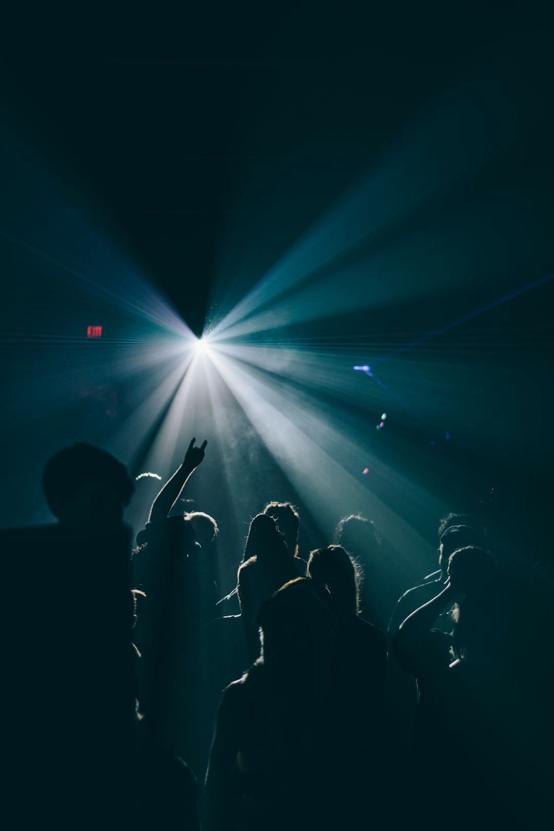 silhouette of people inside dark room