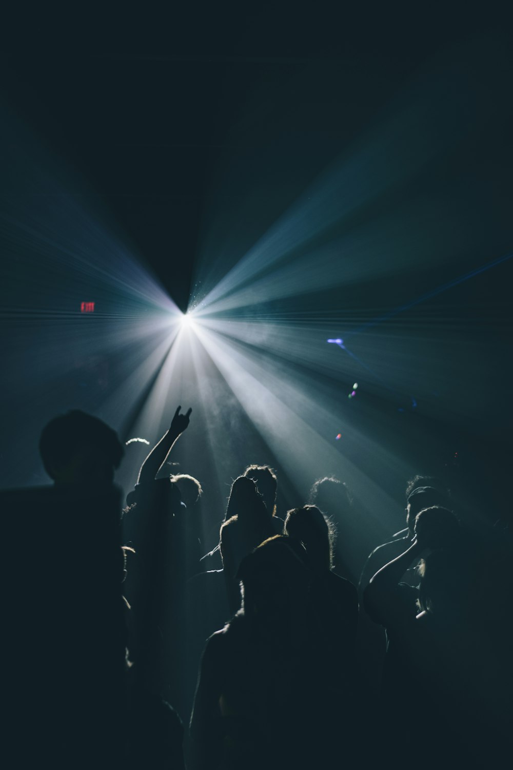 silhouette of people inside dark room