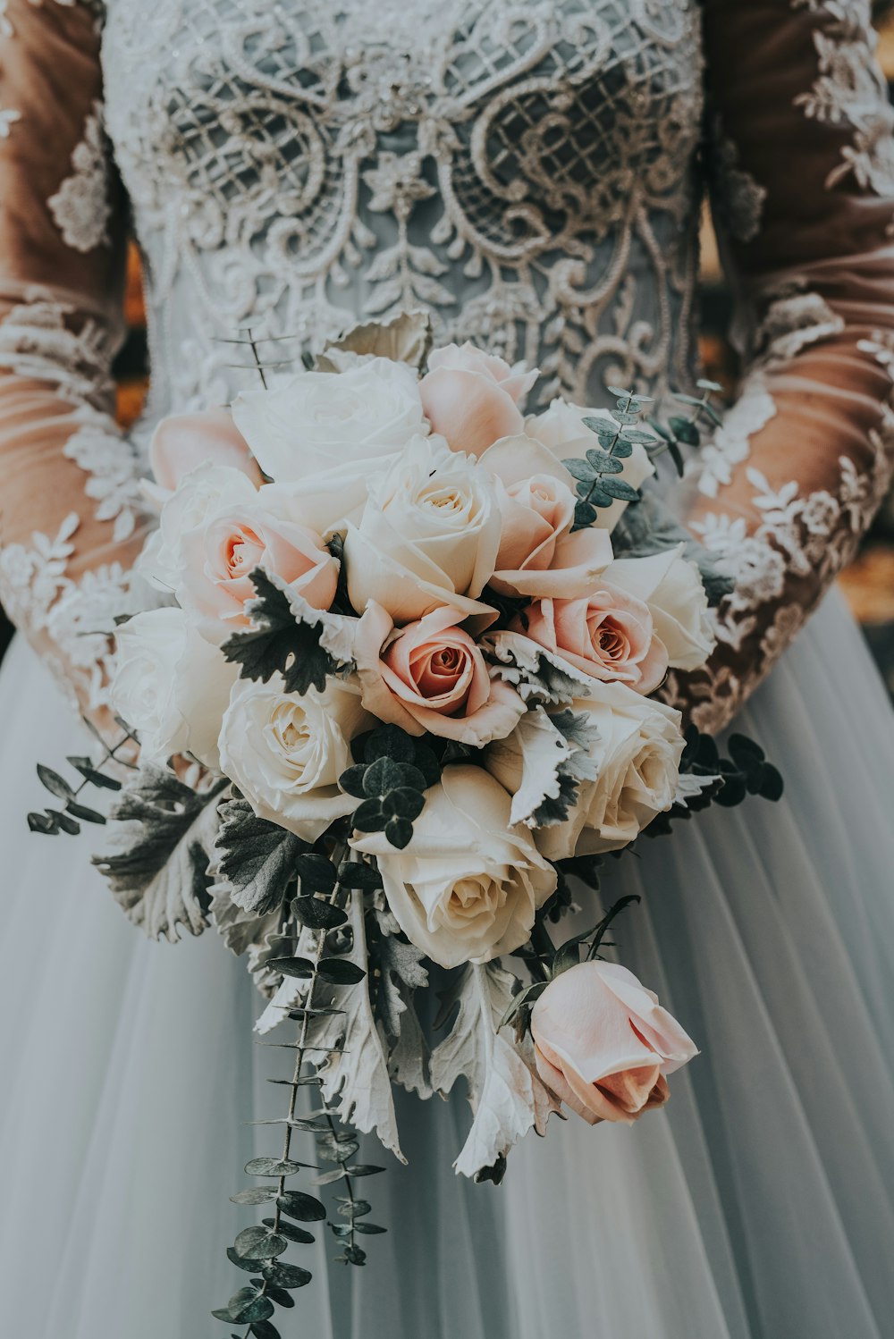 woman holding bouquet of roses