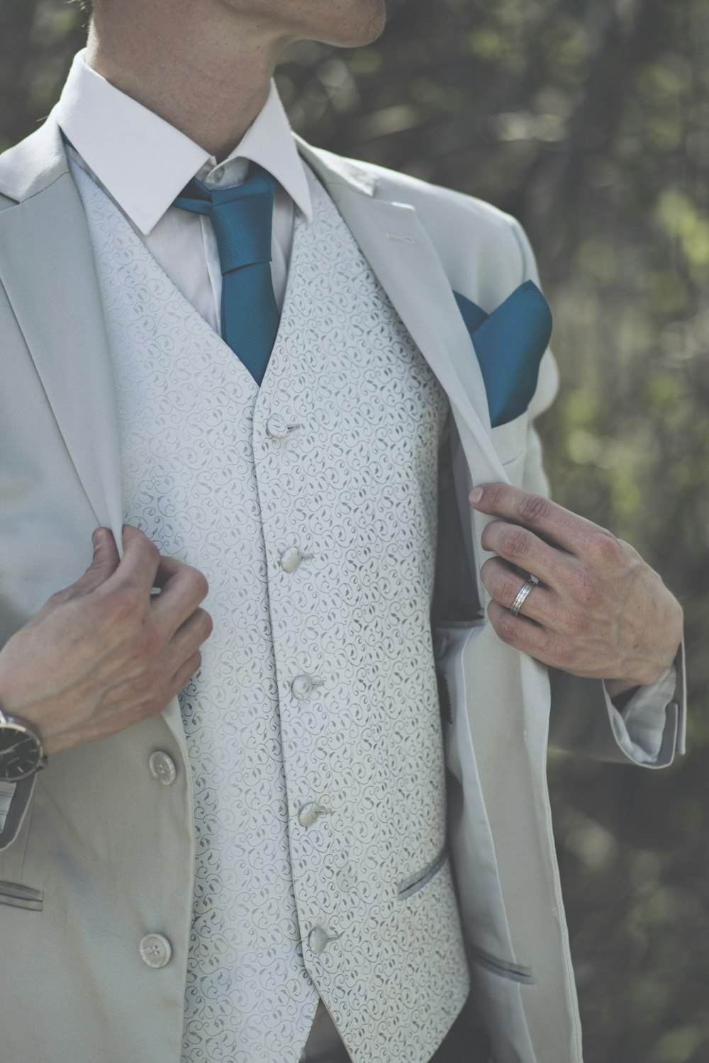 man wearing white suit