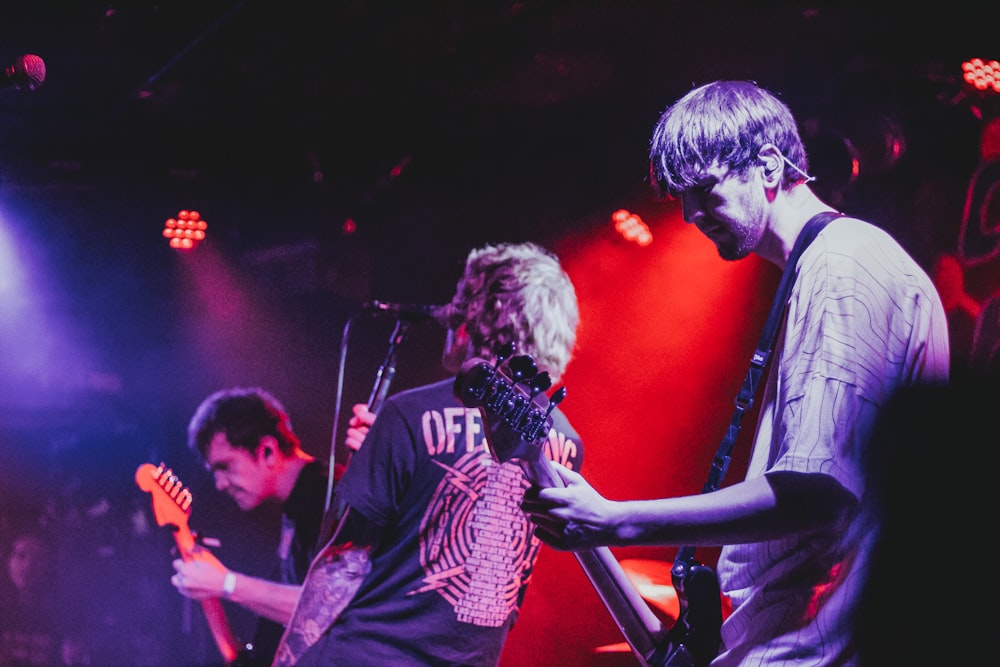 men playing guitars