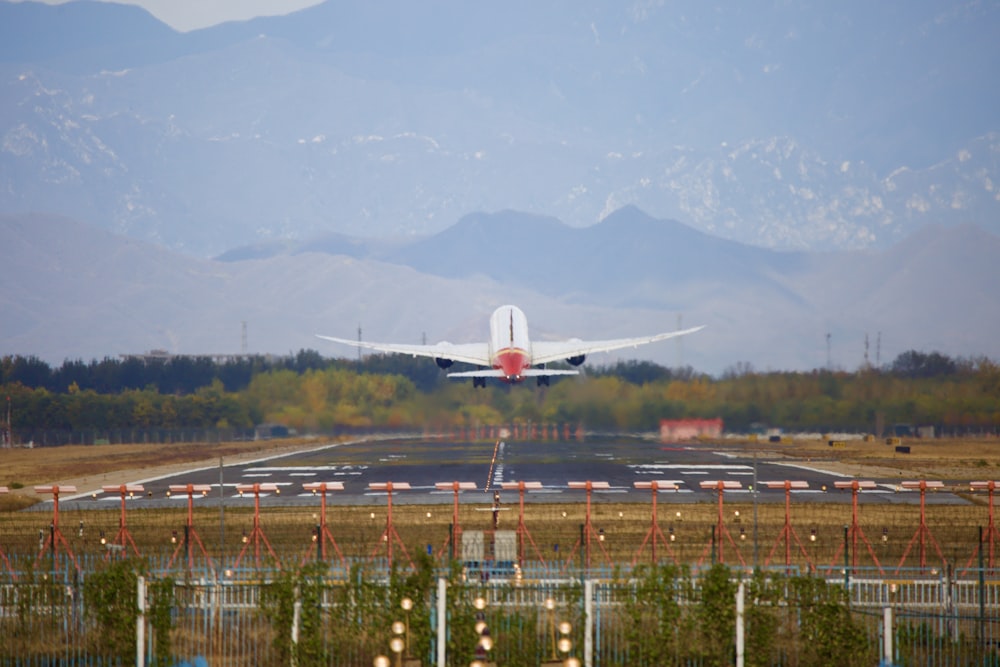 airliner taking off from airport during day
