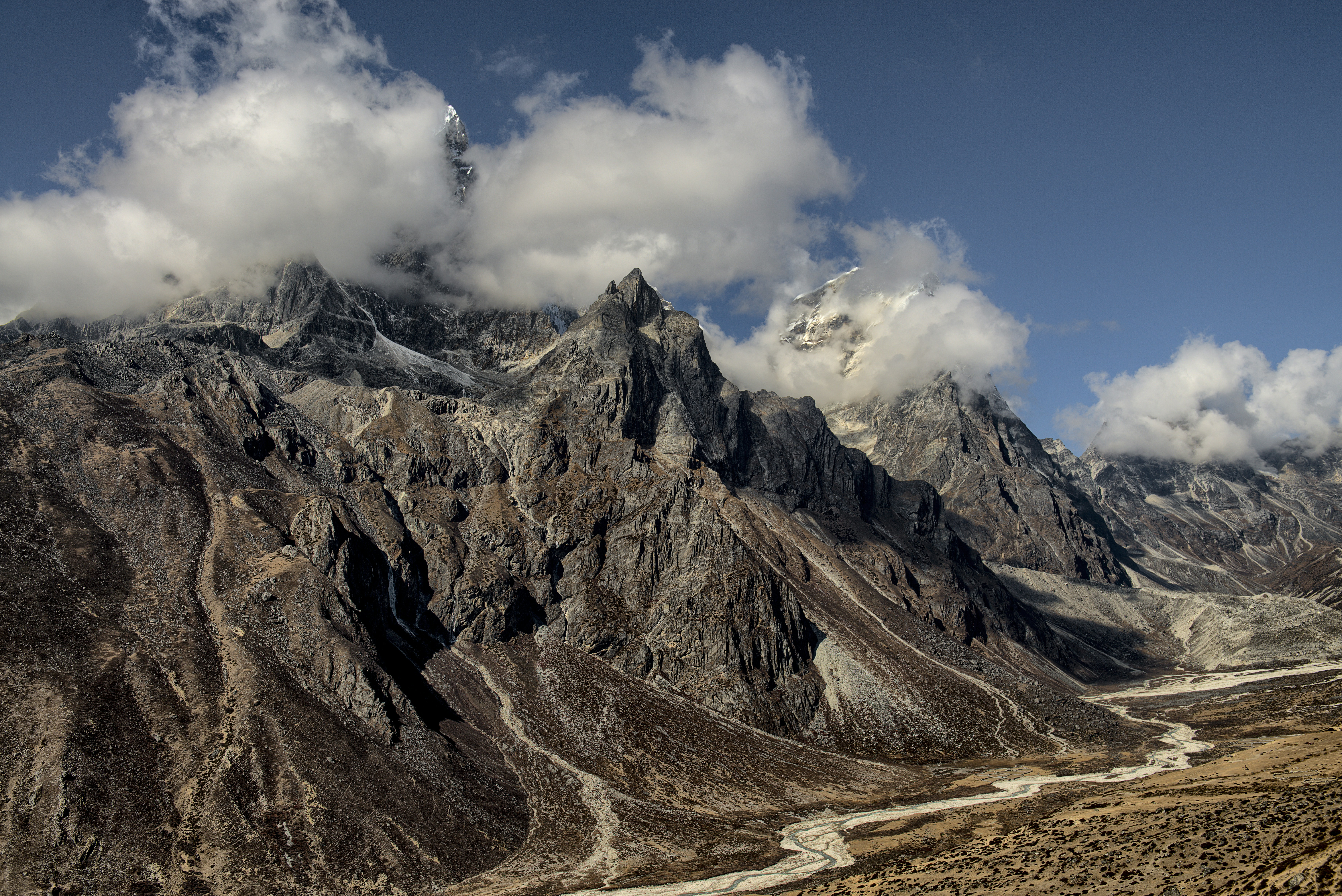 gray rock mountain under blue and white sky, Lobuche Nepal