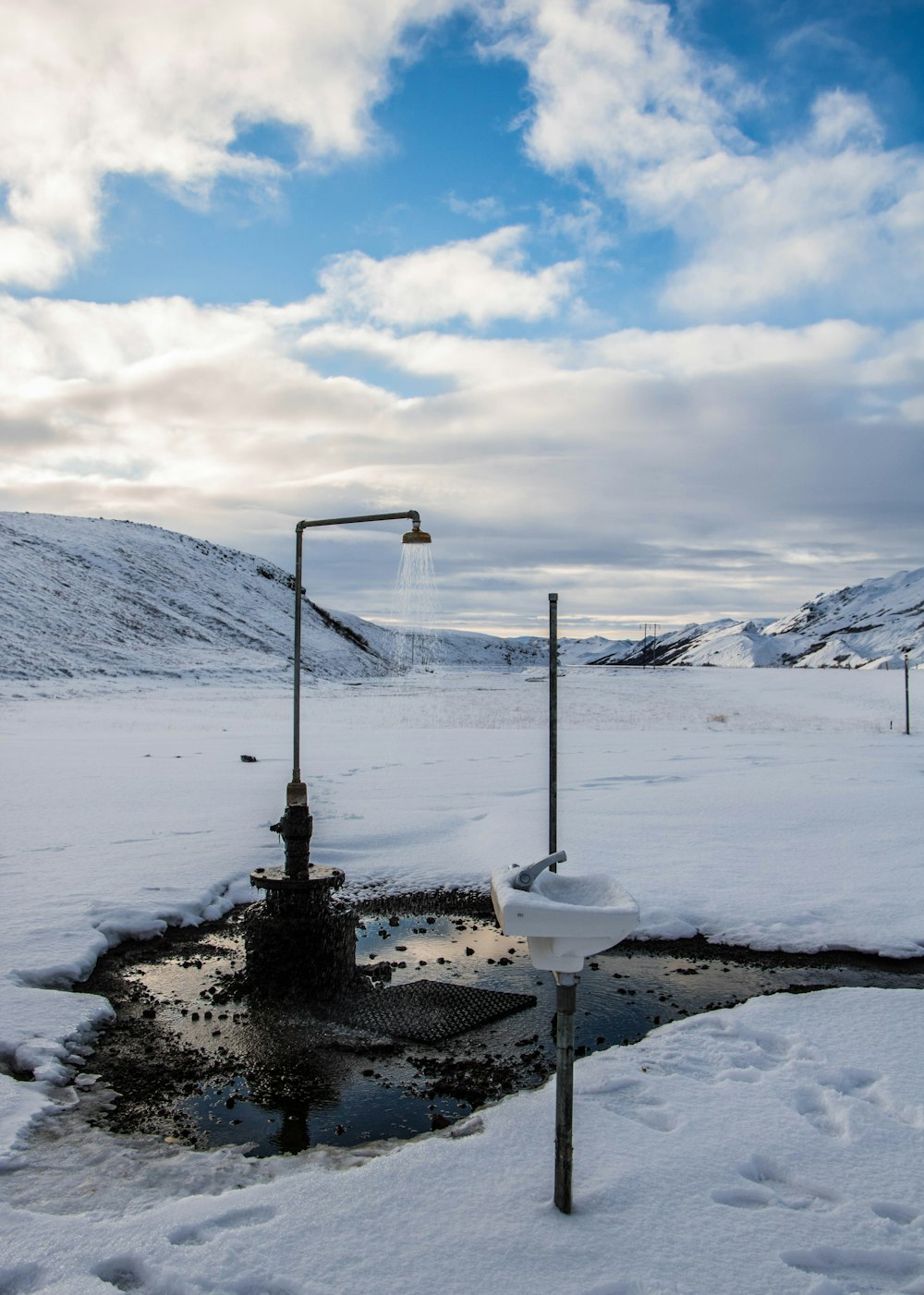 shower surrounded by snow-covered field