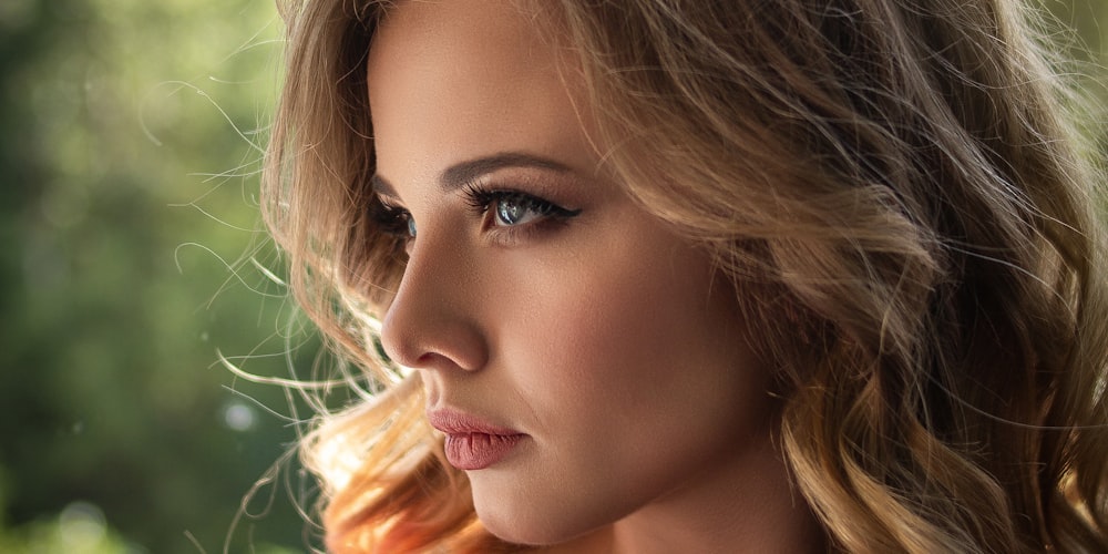 woman with long curly blonde hair