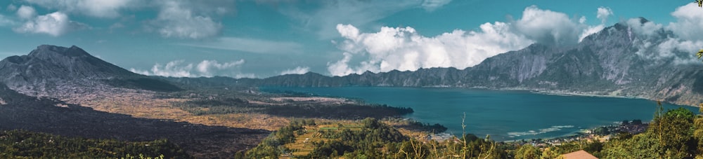 lagoon and mountains during day