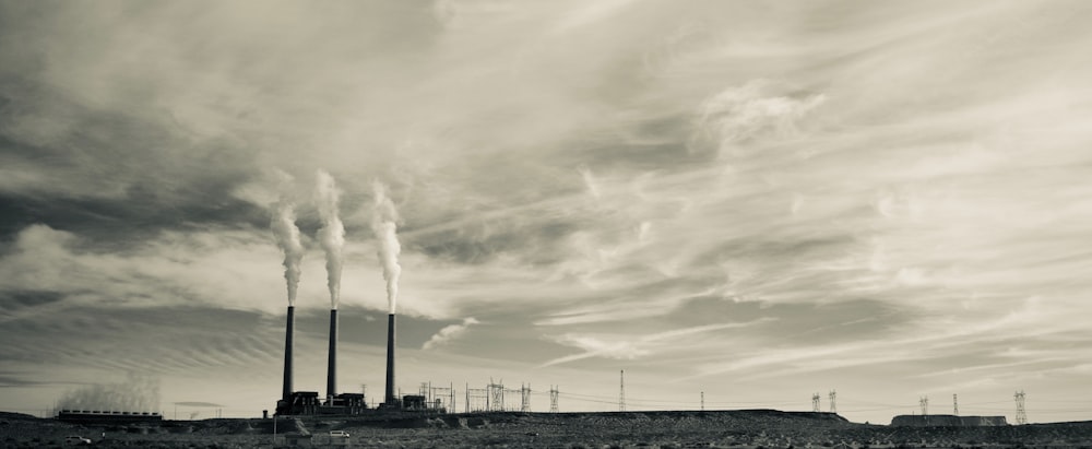 sepia photography of factory during daytime