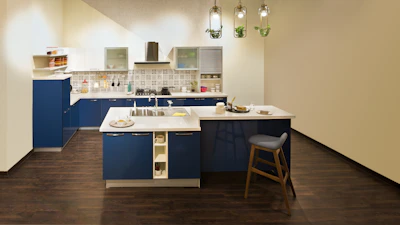 A beautifully renovated kitchen showcasing clean lines and soft blue accents.