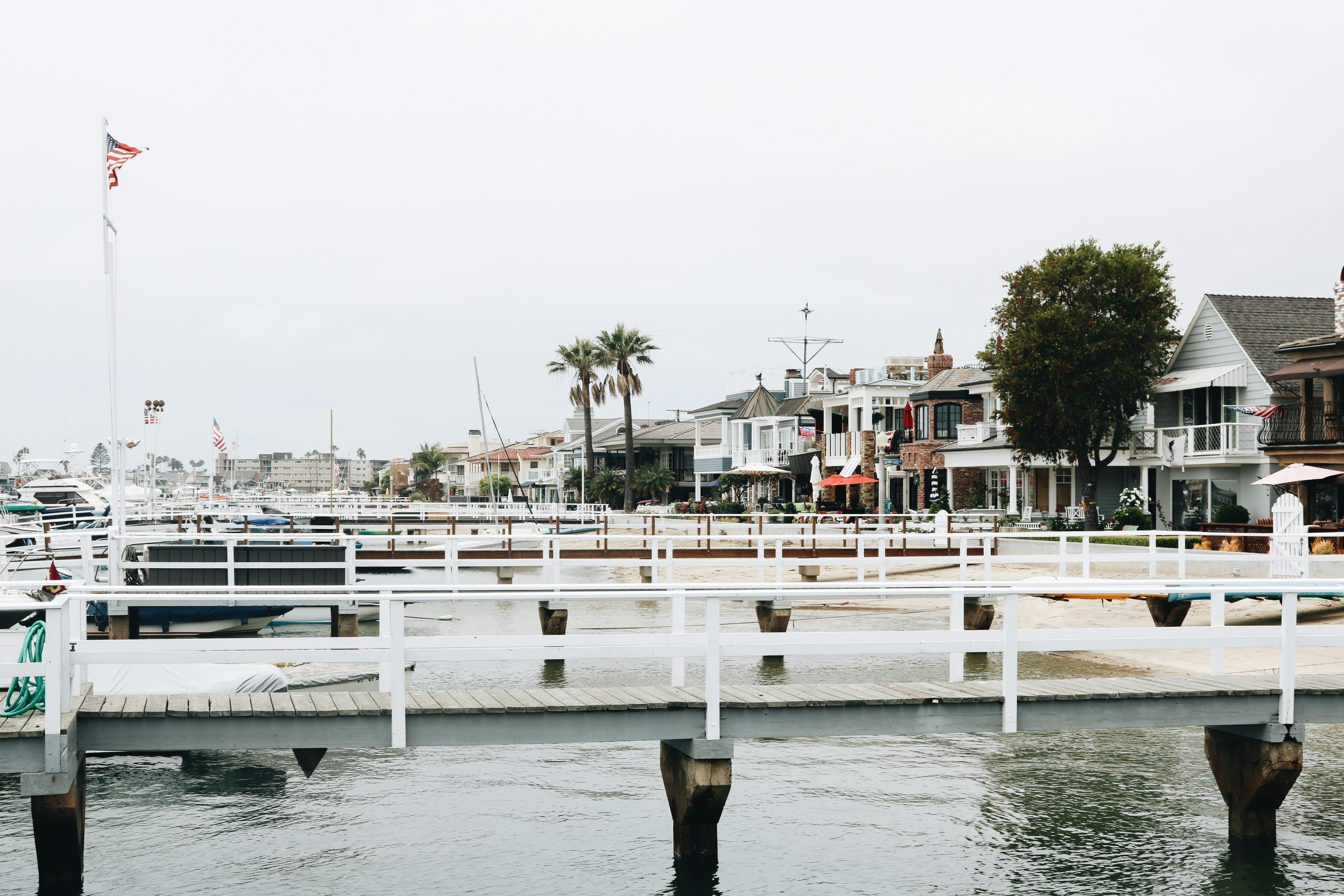 white wooden dock near houses