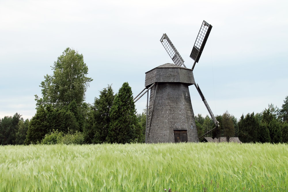black gray windmill near green grass field