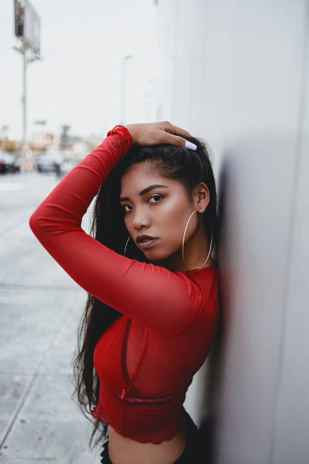 woman leaning on wall