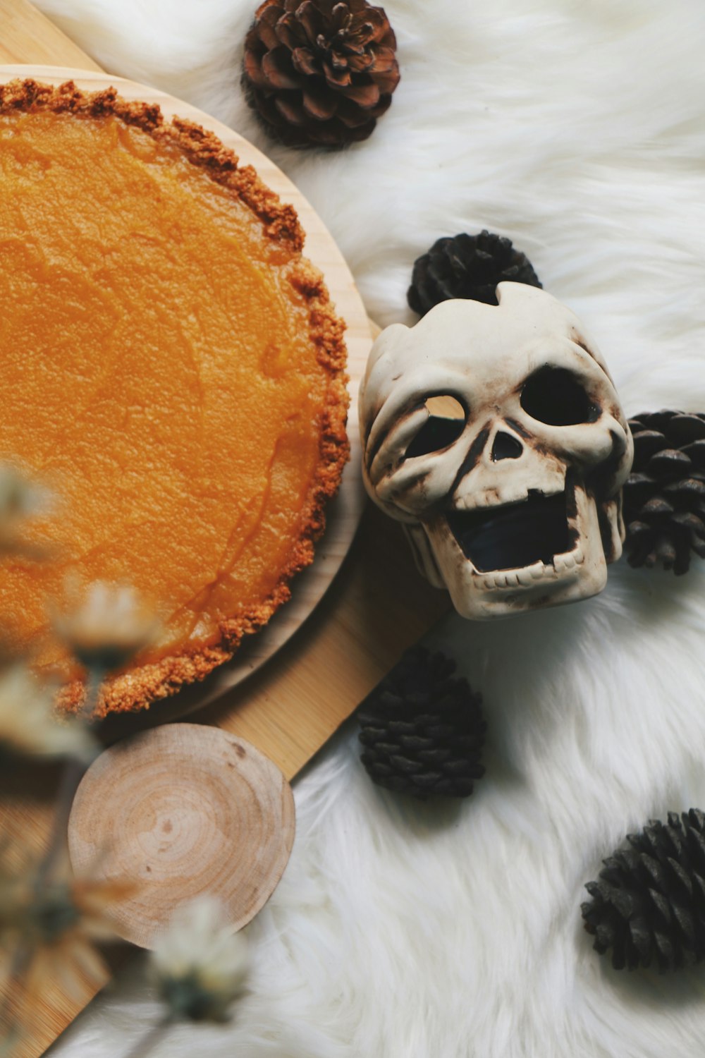 pie beside human skull decor