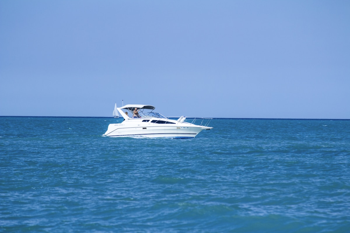 A cabin cruiser underway on open water