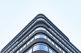 shallow focus photography of curtain wall building