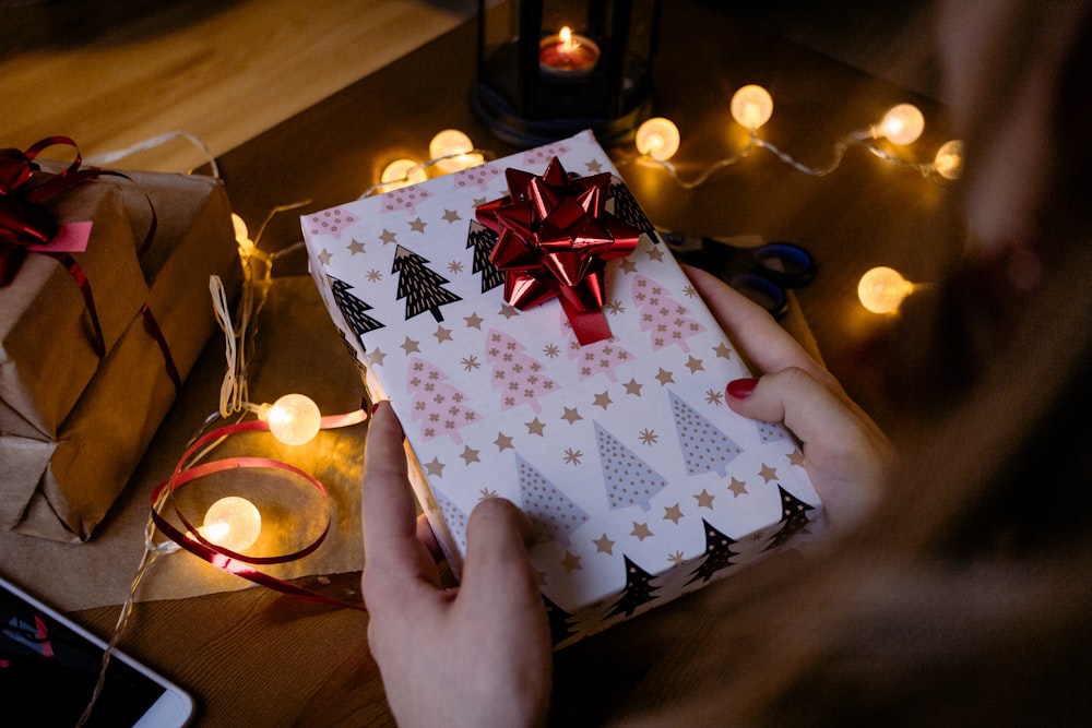 person holding gift box