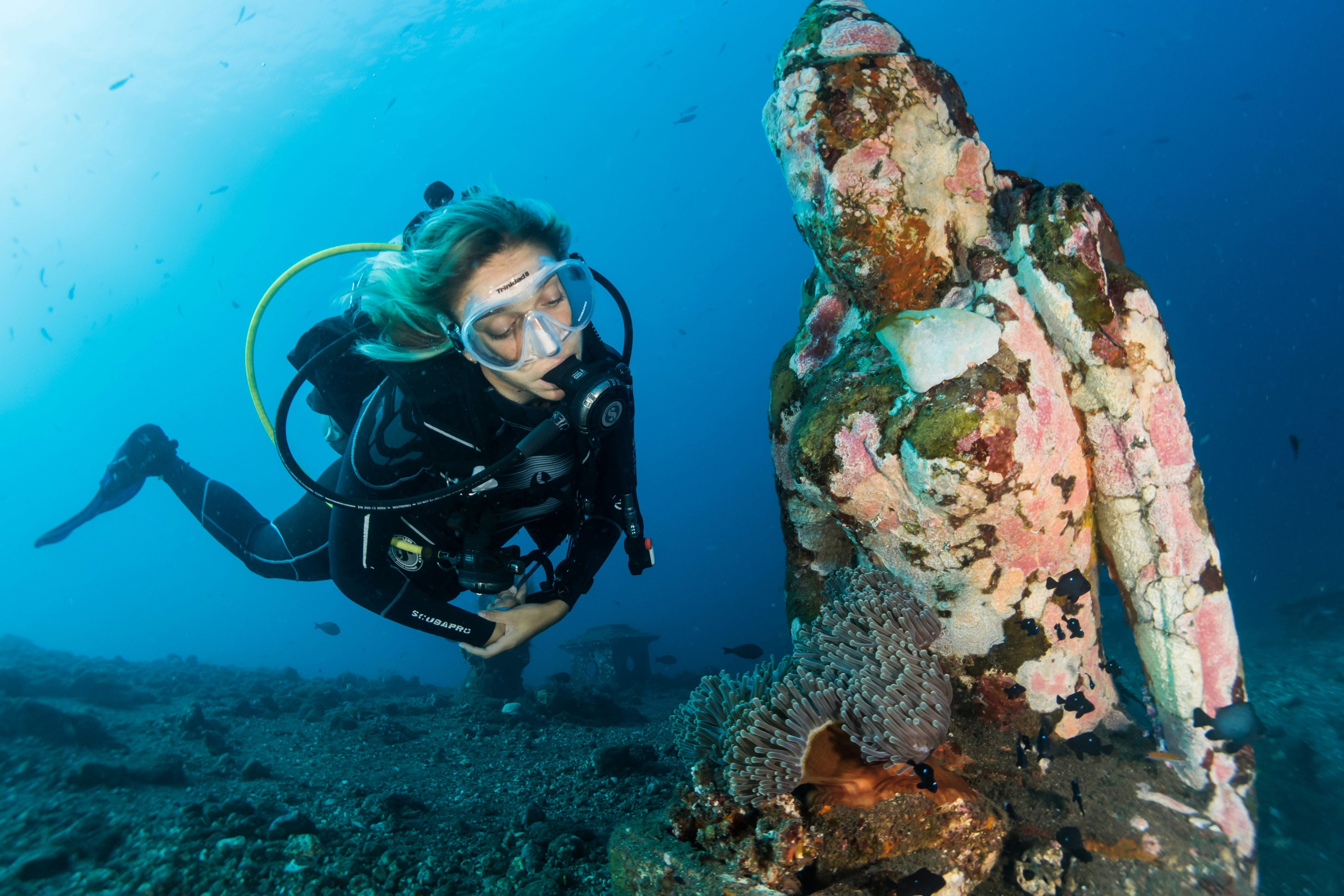 woman scuba diving under water