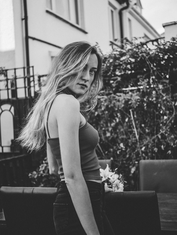 Tall woman dating app member profile shown on a phone