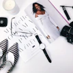 A flat lay of feminine accessories including scarves, hair clips, and rings arranged with Japanese-inspired patterns.