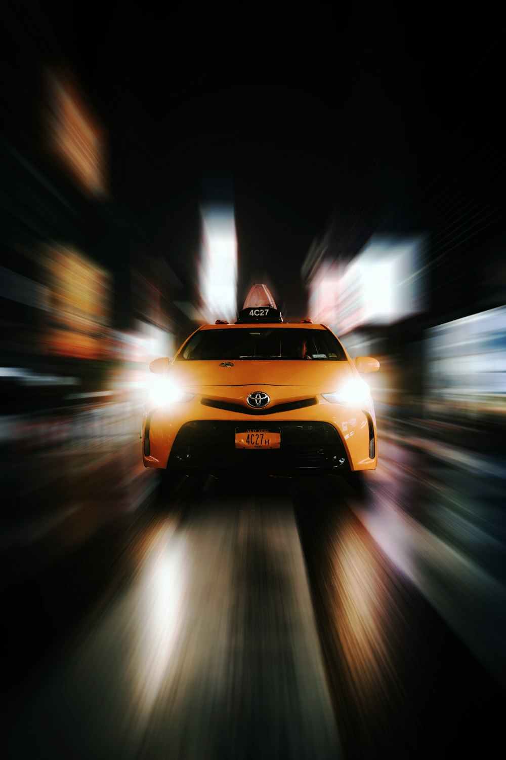 yellow Toyota taxi cab in selective focus phootography