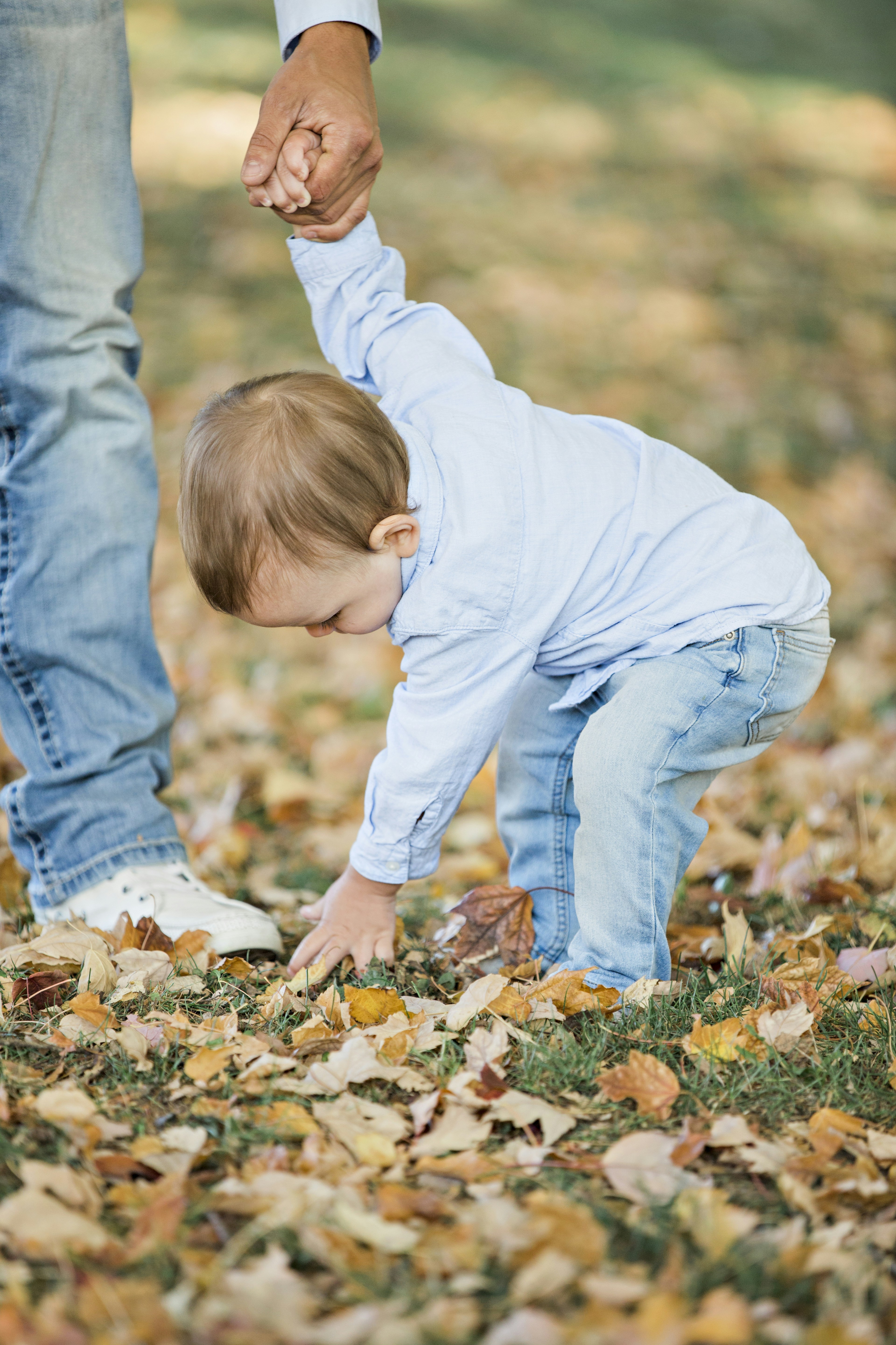 Canon EF 70-200mm F2.8L IS III USM sample photo. Person holding toddler picking photography