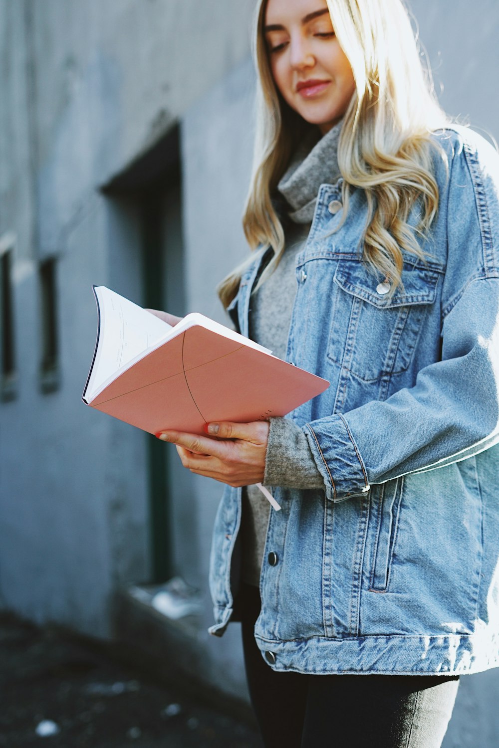 standing woman holding book