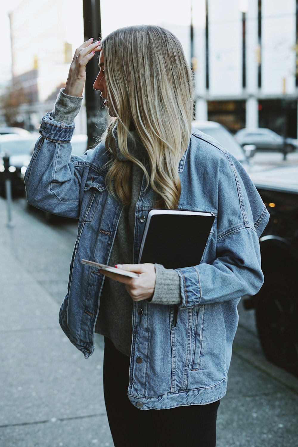 woman holding black book