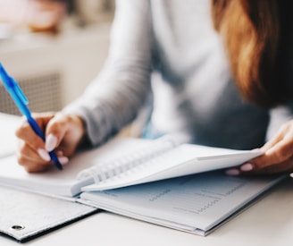 woman writing using pen