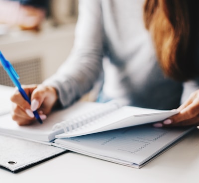 woman writing using pen