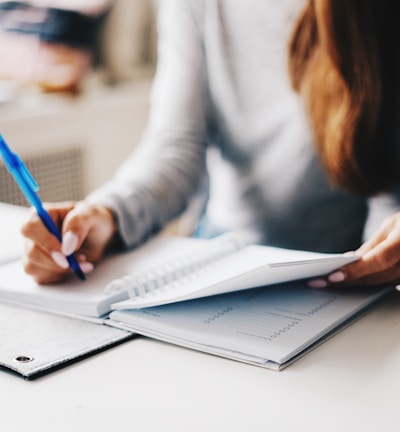 woman writing using pen