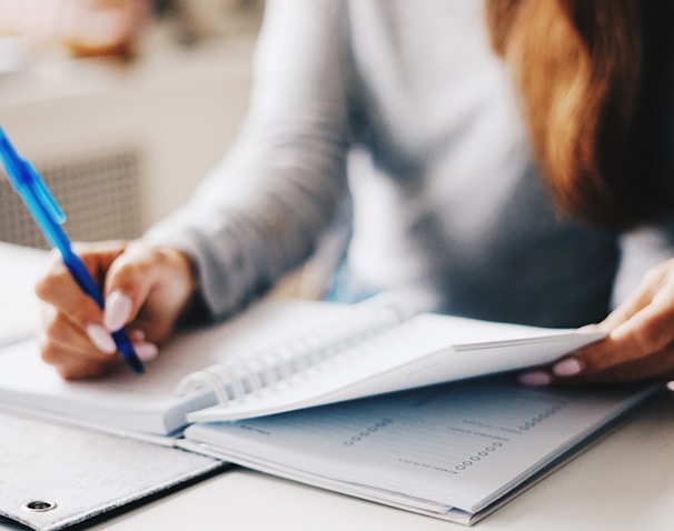 woman writing using pen