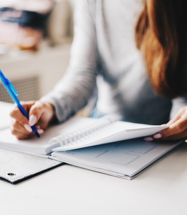 woman writing using pen