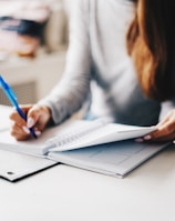 woman writing using pen