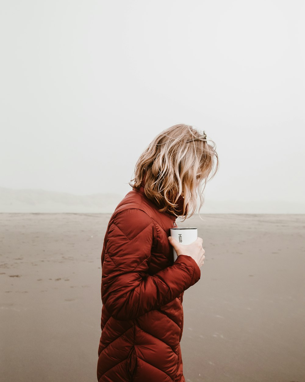 woman holding cup