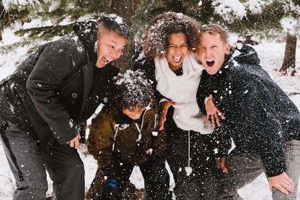 Family in the snow laughing