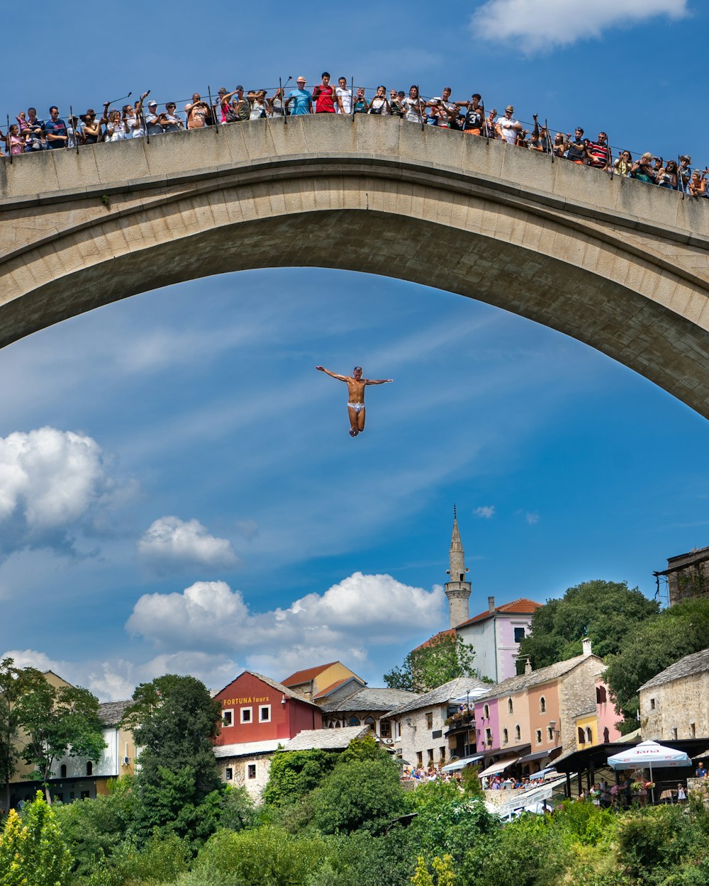 people on bridge at daytime