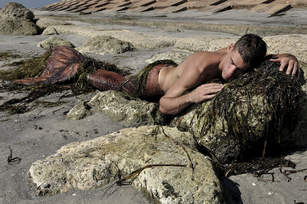 mermaid pruning on brown rock