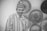 greyscale photo of smiling man wearing dress shirt