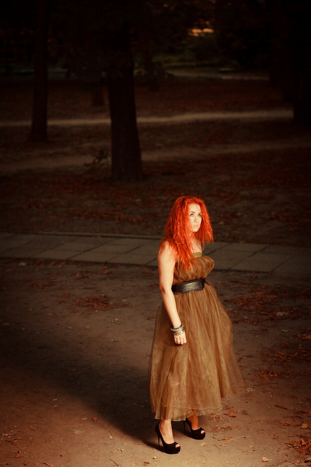 woman standing near pavement