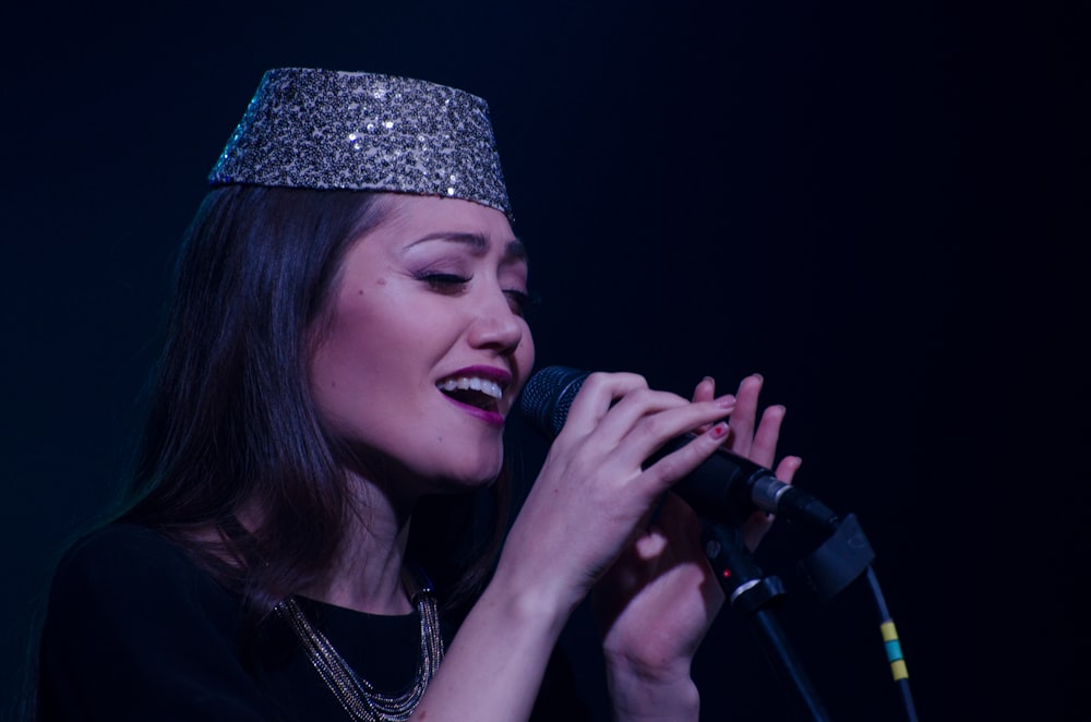 woman holding microphone