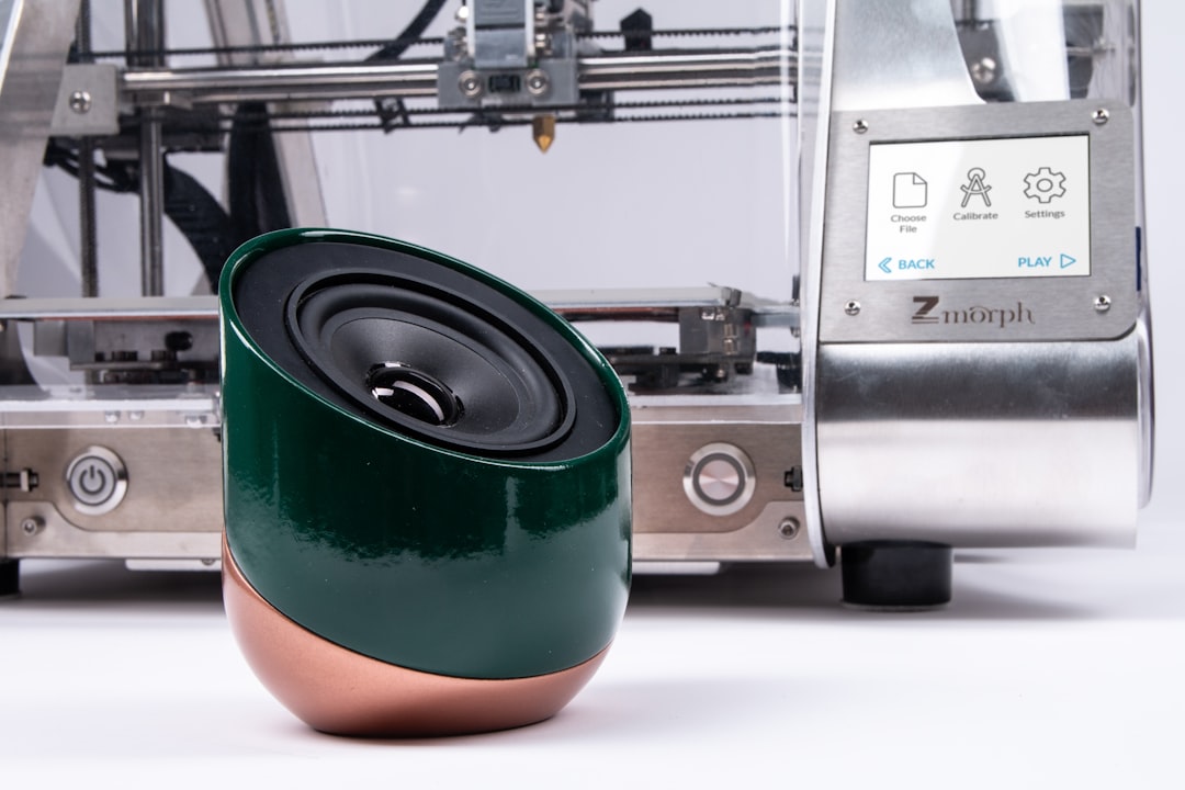 round black and brown portable speaker in close-up photography, This Wireless Bluetooth Speaker was 3D printed on ZMorph VX Multitool 3D Printer.